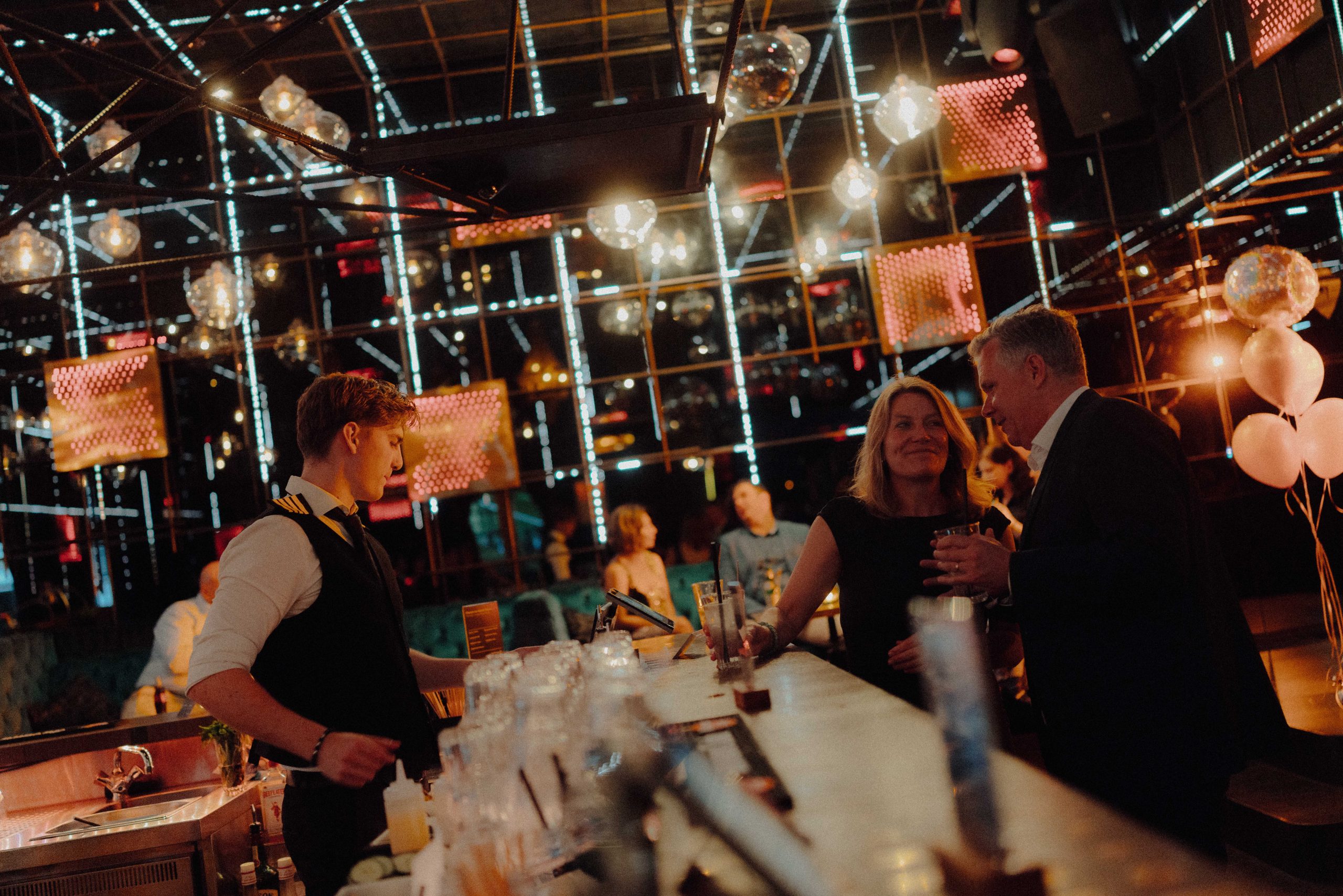 Evening mood with guests gathered around the bar area
