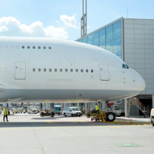 A380 fuselage and front section from the side at the gate at the airport